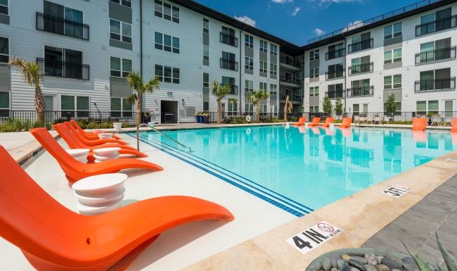 a swimming pool in front of a building