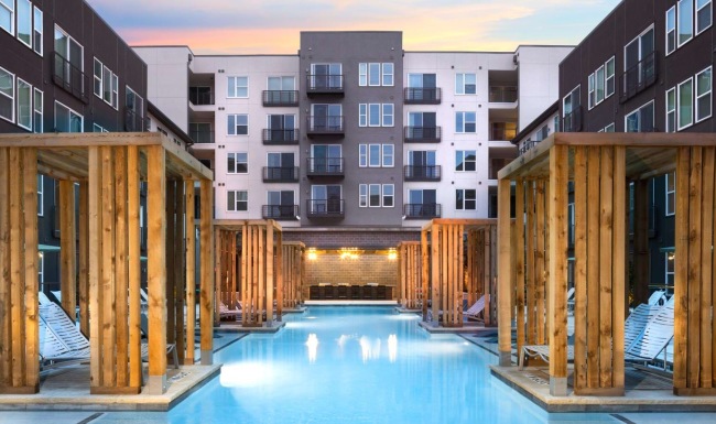 a pool in a courtyard between buildings