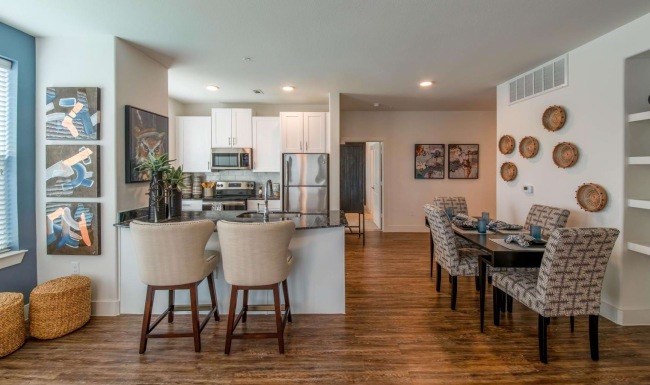 a large kitchen with a dining table
